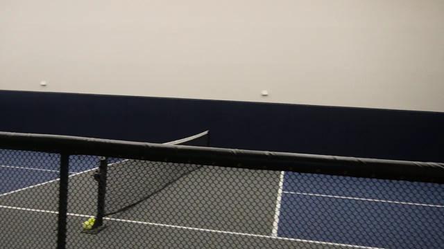 A pickleball net on one of the indoor courts