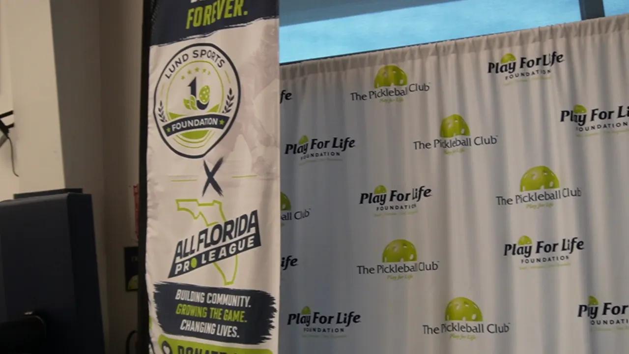 Play For Life banner at the pickleball club